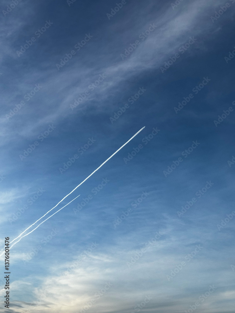 Airplane Contrails in a Vast Blue Sky