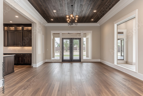 Modern Empty Room with Dark Wood Ceiling and French Doors