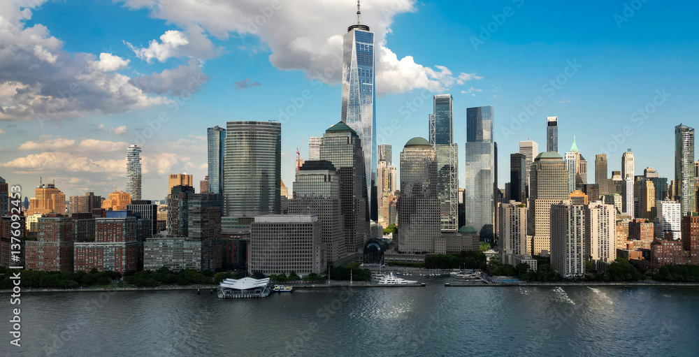Fototapeta premium New York City an sky with clouds. NYC cityscape with skyscrapers. Aerial panorama of New York City skyline. Manhattan skyline. New York and Hudson River. Downtown NYC. New York skyscrapers from above.