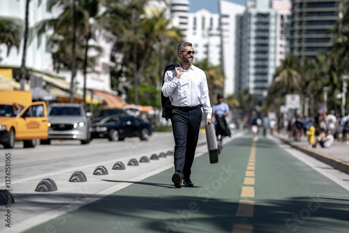 Wallpaper Mural Business man walk to work. Hispanic business man walking on the street confidently. Office worker on way to office. Mature business man walking on city. Businessman walking outdoors. Business style. Torontodigital.ca