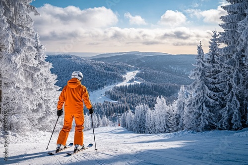 A skier in bright orange gear stands poised on a snowy slope. The panoramic view stretches far into the frosty landscape. Experience winter wonder. Generative AI