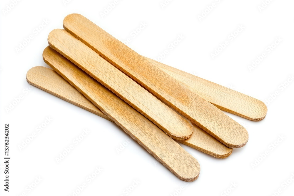 Wooden popsicle sticks. Stacked, light brown, simple, and smooth. Perfect for ice cream, fruit, or dessert Wooden popsicle sticks. Stacked, light brown, simple, and smooth. Perfect for ice cream, fruit, or dessert