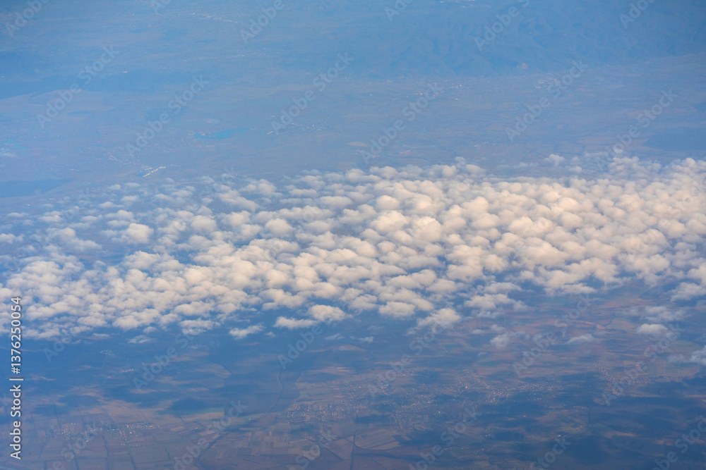 Naklejka premium Blue sky with white clouds, flying above cloudy sky texture pattern, cloudscape blurred light