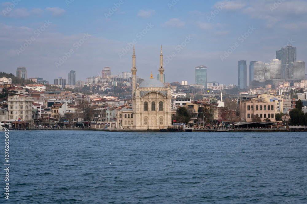 Ortakoy Mosque (Buyuk Medjidie Kamii) in Besiktas district on the embankment of the Ortakoy Pier Square from the waters of the Bosphorus, Istanbul, Turkey Ortakoy Mosque (Buyuk Medjidie Kamii) in Besiktas district on the embankment of the Ortakoy Pier Square from the waters of the Bosphorus, Istanbul, Turkey