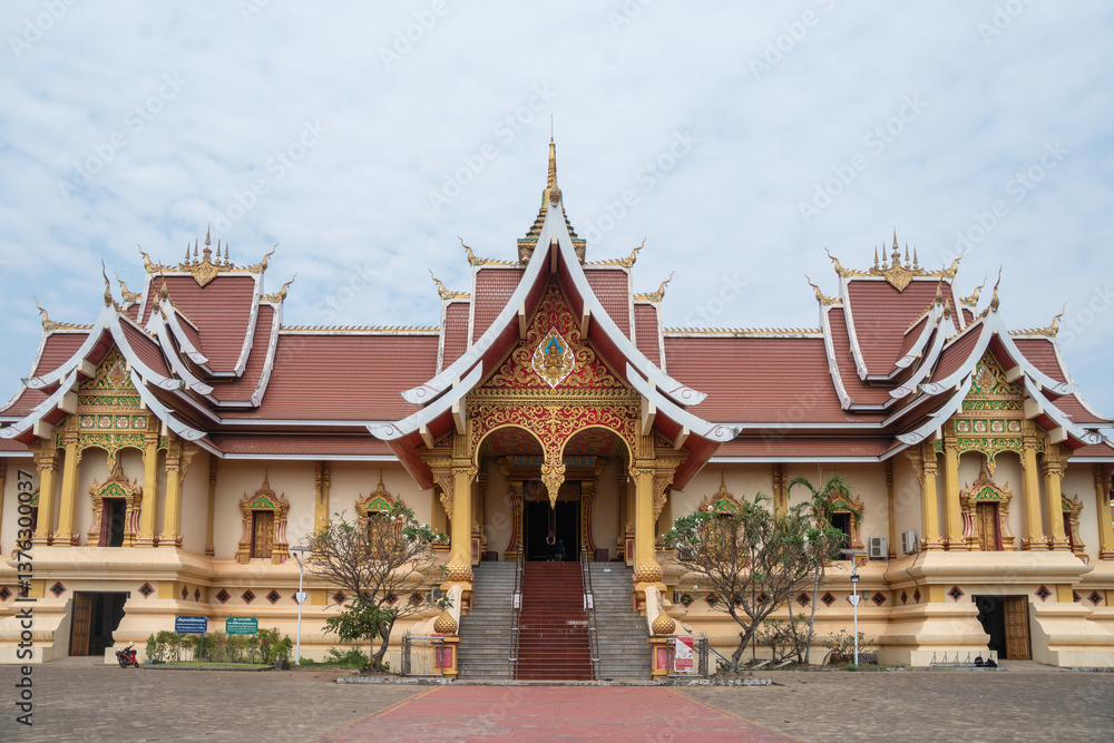 Naklejka premium Experience the stunning and magnificent Golden Stupa located at Wat That Luang in Vientiane, Laos
