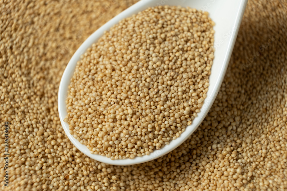 Uncooked amaranth seeds in a spoon Uncooked amaranth seeds in a spoon