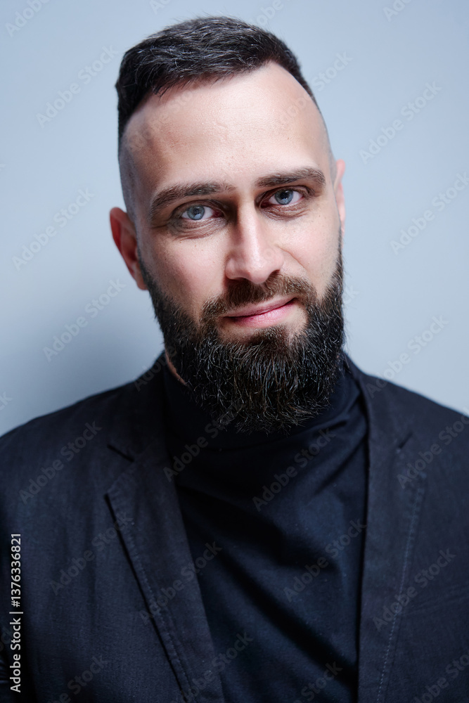 Obraz premium Studio portrait of young handsome man with beard.