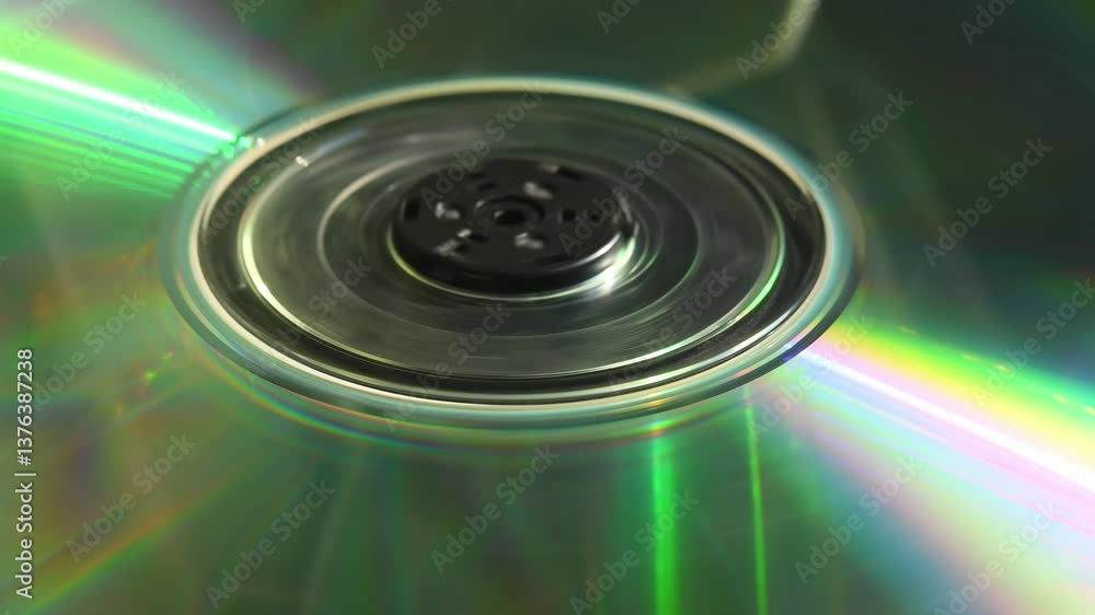 CD disc spinning and stopping under light, reflecting rainbow colors evoking nostalgic 90s tech atmosphere in 4K CD disc spinning and stopping under light, reflecting rainbow colors evoking nostalgic 90s tech atmosphere in 4K