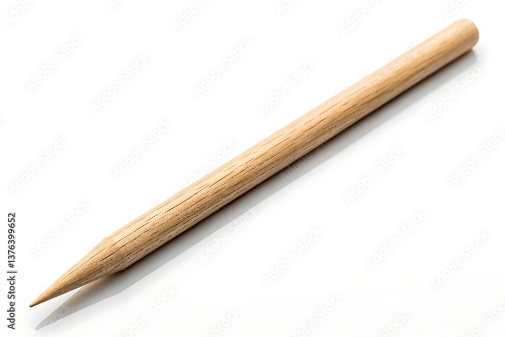 A simple, elegant wooden dowel, perfectly smooth and pointed, ready for any crafting project or creative endeavor against a bright white background. A simple, elegant wooden dowel, perfectly smooth and pointed, ready for any crafting project or creative endeavor against a bright white background.