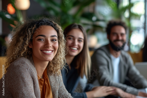 Business meeting with multicultural professionals smiling in a modern workspace