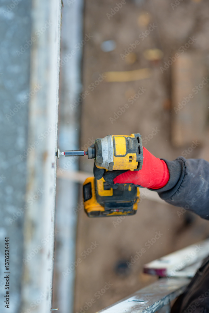 Connection of reinforcement into the frame. A knot tied with a handle. Reinforcement works. Construction. Connection of reinforcement into the frame. A knot tied with a handle. Reinforcement works. Construction.