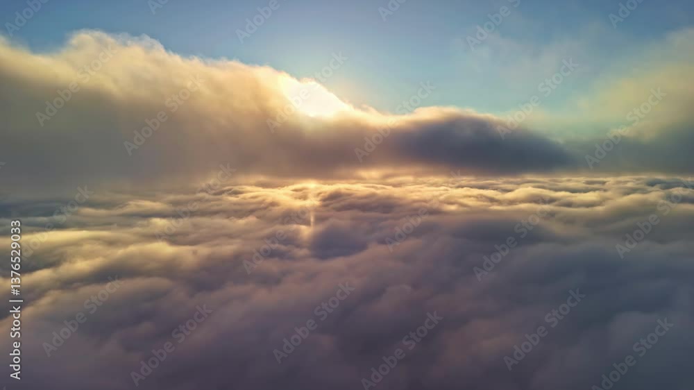 Golden Light Glowing Behind Cloudscape At Sunset. Aerial Shot Golden Light Glowing Behind Cloudscape At Sunset. Aerial Shot