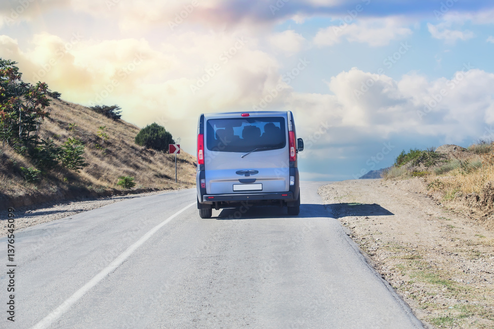 Minivan Drives up the Mountain Road Minivan Drives up the Mountain Road