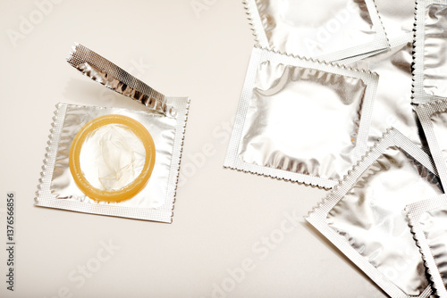 An open condom in a package. Male contraceptives.