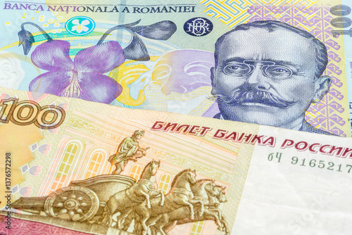 Wallpaper Mural 100 Romanian leu and 100 Russian ruble banknotes. International trade concept Torontodigital.ca