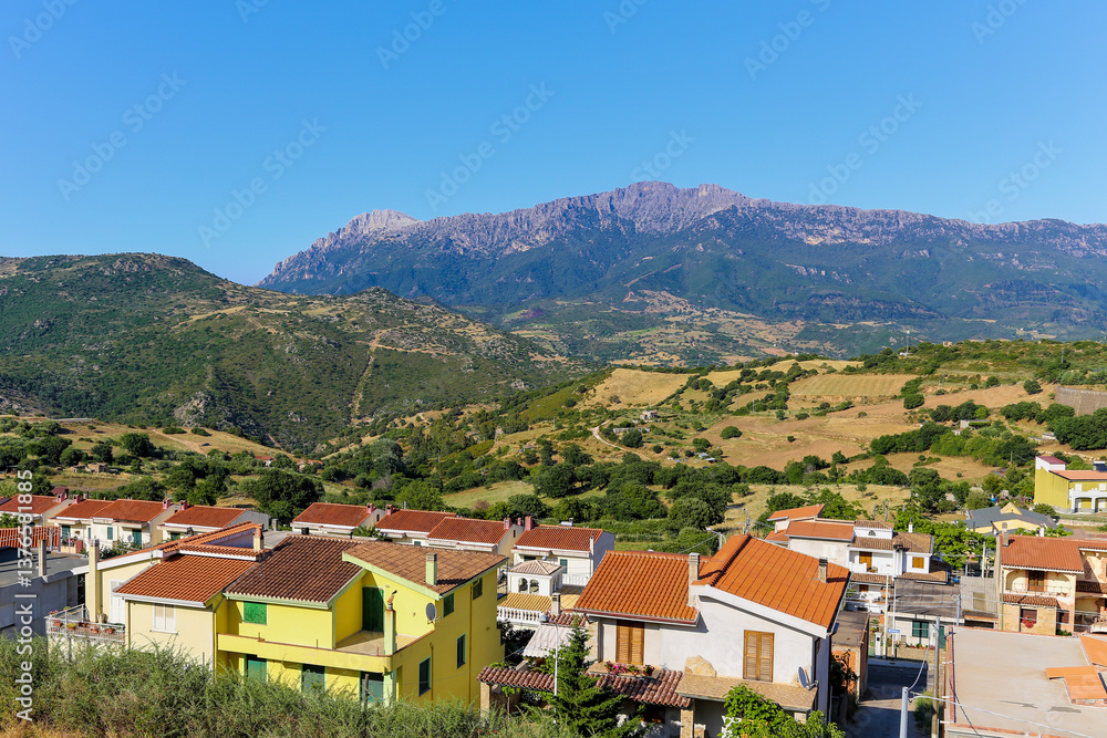 Fototapeta premium A road view of the town of Orgosolo on the island of Sardinia in Italy