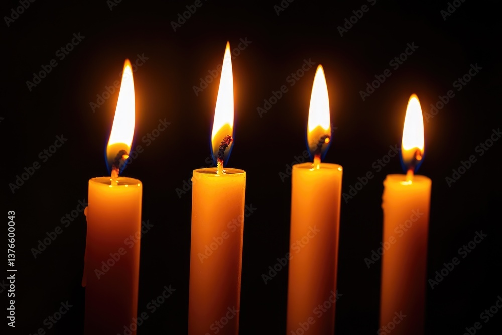 Illuminated Christmas Spirit: Five Candles Casting Glowing Light in a Dark Setting Illuminated Christmas Spirit: Five Candles Casting Glowing Light in a Dark Setting