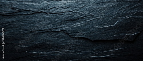 Black obsidian texture with sharp edges, glassy surface and light reflections, rock texture, volcanic origin and mystical stone material