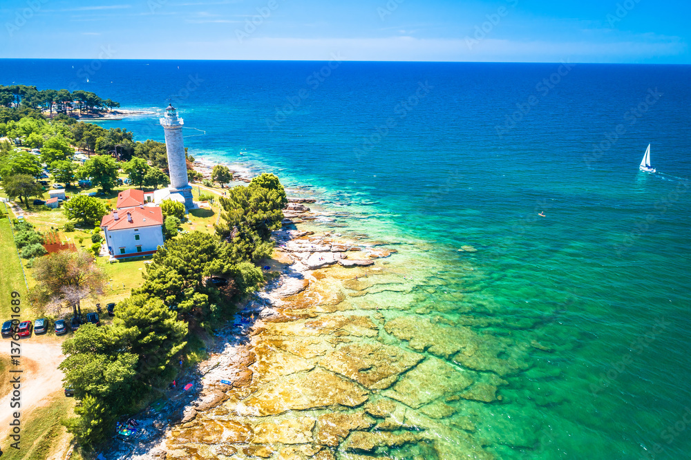 Croatia. Savudrija lighthouse and turquoise crystal clear rocky beach aerial view