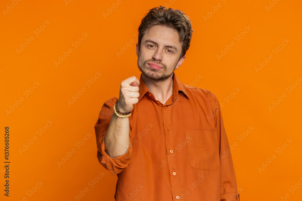 Greedy avaricious Caucasian man showing fig negative gesture you don't get it anyway. Rapacious avaricious acquisitive. Body language. Refusal fig sign. Young guy isolated on orange background indoors Greedy avaricious Caucasian man showing fig negative gesture you don't get it anyway. Rapacious avaricious acquisitive. Body language. Refusal fig sign. Young guy isolated on orange background indoors