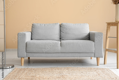 Obraz na płótnie Stylish interior of living room with soft grey sofa w salonie