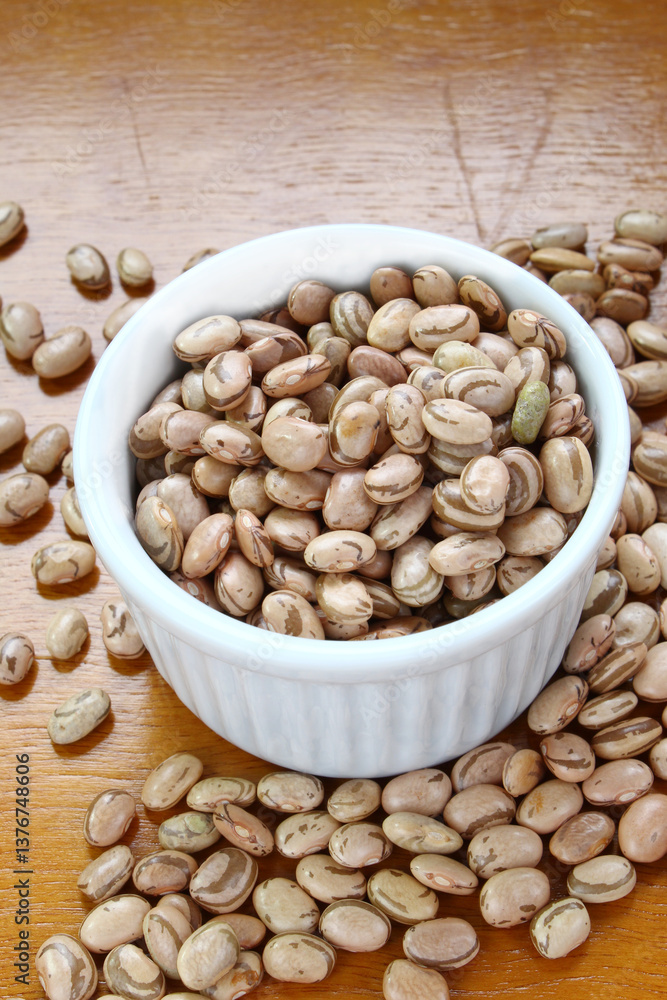 Carioca beans in a white bowl. Traditional grains in Brazil. Carioca beans in a white bowl. Traditional grains in Brazil.
