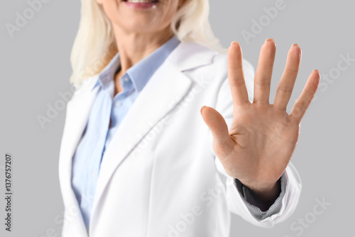 Mature businesswoman using ...