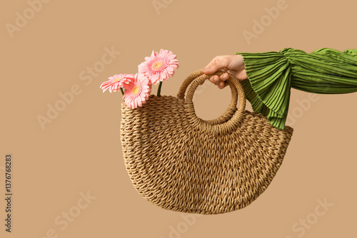 Female hand holding straw b...