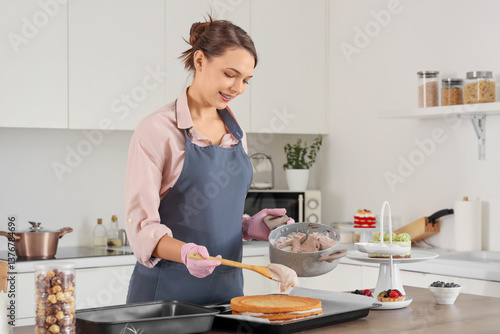 Female confectioner greasin...
