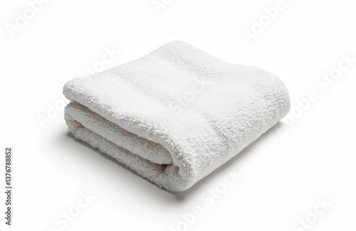 White fluffy towel isolated on white background. Stacked cotton soft terry cloth folded clean bathroom accessory. Spa element. Hotel hygiene. Bath textile, wipe.
