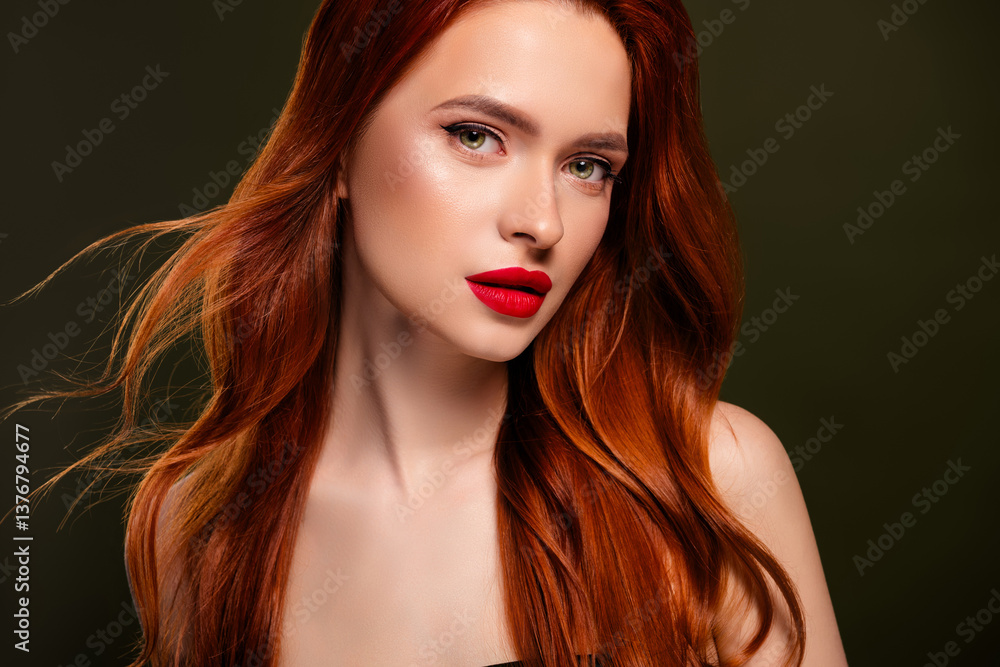 Fototapeta premium Portrait of stunning adorable lady shiny ginger hair enjoying red pomade isolated khaki color background