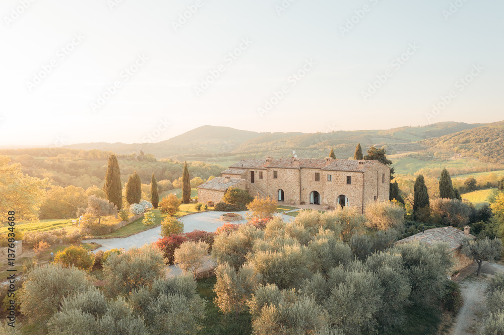 Tuscan villa basks in golden light, showcasing idyllic Italian countryside living