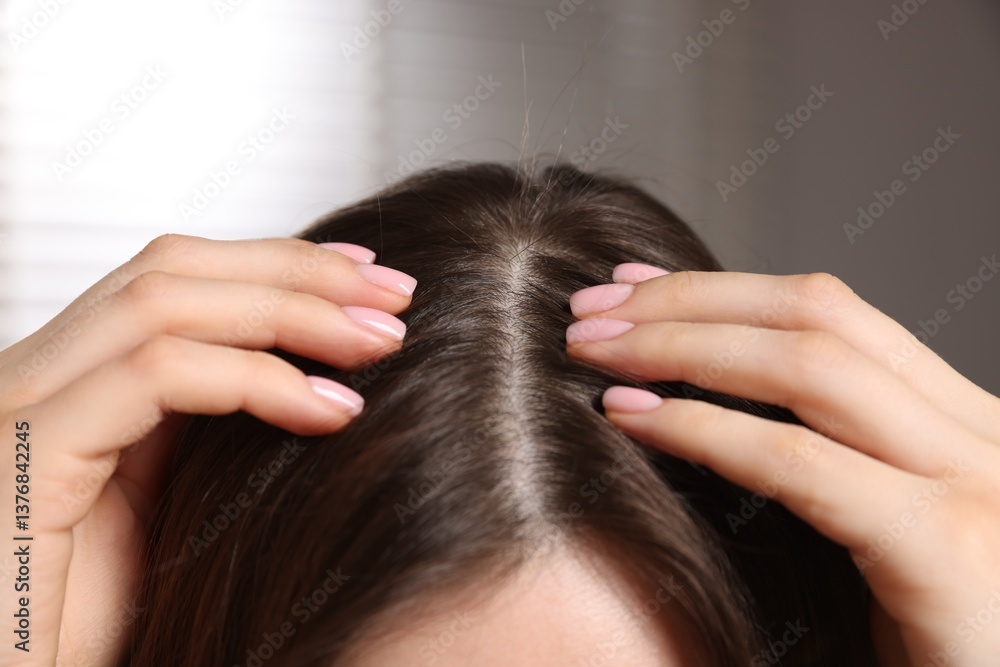 Naklejka premium Woman with healthy hair roots on blurred background, closeup