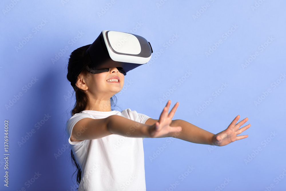 Cyberspace Concept. Happy asian kid wearing VR helmet, experiencing virtual reality, turquoise studio wall Cyberspace Concept. Happy asian kid wearing VR helmet, experiencing virtual reality, turquoise studio wall