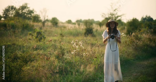 Wallpaper Mural Smiling girl taking photos in the fields Torontodigital.ca