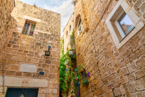 Canvastavla Residential apartments closely packed together with narrow alleys and passageways full of small balconies and garden windows in the ancient Old Jaffa district, Tel Aviv Israel