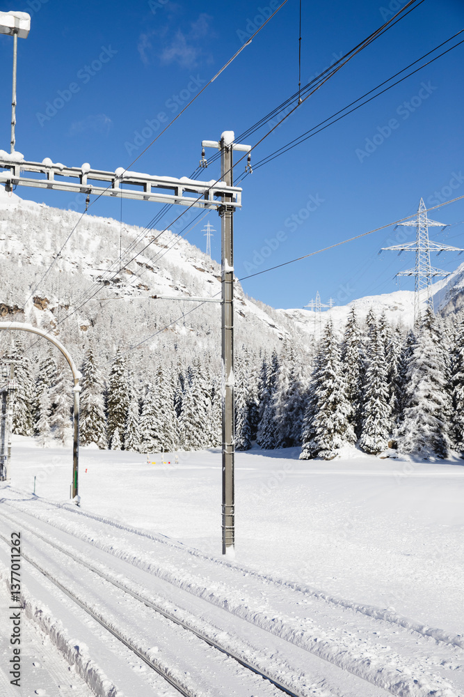 Snow-covered railway tracks in a winter landscape Snow-covered railway tracks in a winter landscape