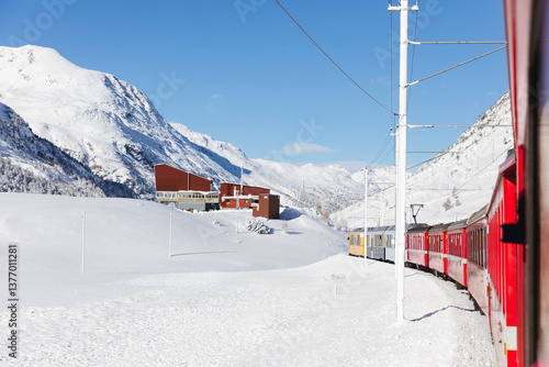 Wallpaper Mural Train passing by a snow-covered alpine cable car station Torontodigital.ca
