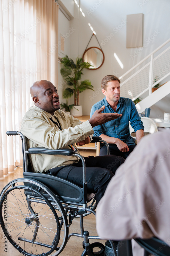 Man in wheelchair discussing in psychotherapy session Man in wheelchair discussing in psychotherapy session