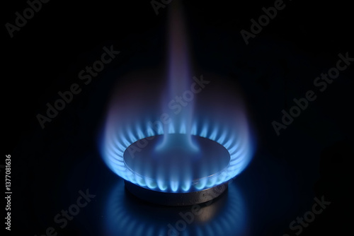 Obraz na płótnie Captivating close-up of a vibrant blue gas flame in the kitchen, showcasing clean energy and precise control for culinary excellence and home comfort w salonie