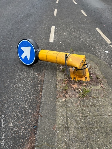 broken traffic bollard on street