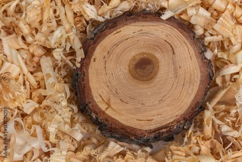 Wooden Cross Section with Sawdust Background