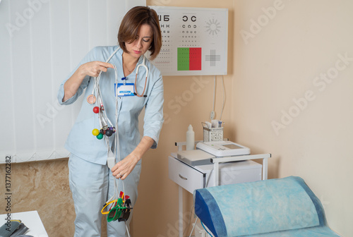 Cardiologist prepares a cardiograph for the procedure