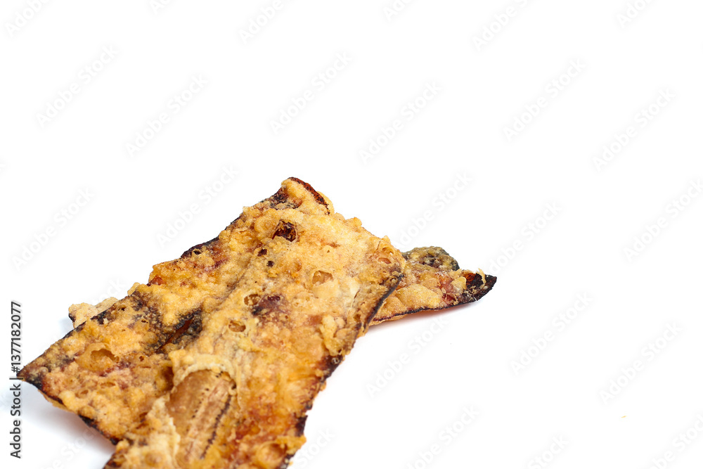 Traditional food called crispy banana is made from sliced bananas coated in flour and then fried until cooked. Traditional food called crispy banana is made from sliced bananas coated in flour and then fried until cooked.