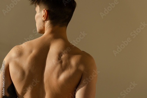 A man with a bulky back