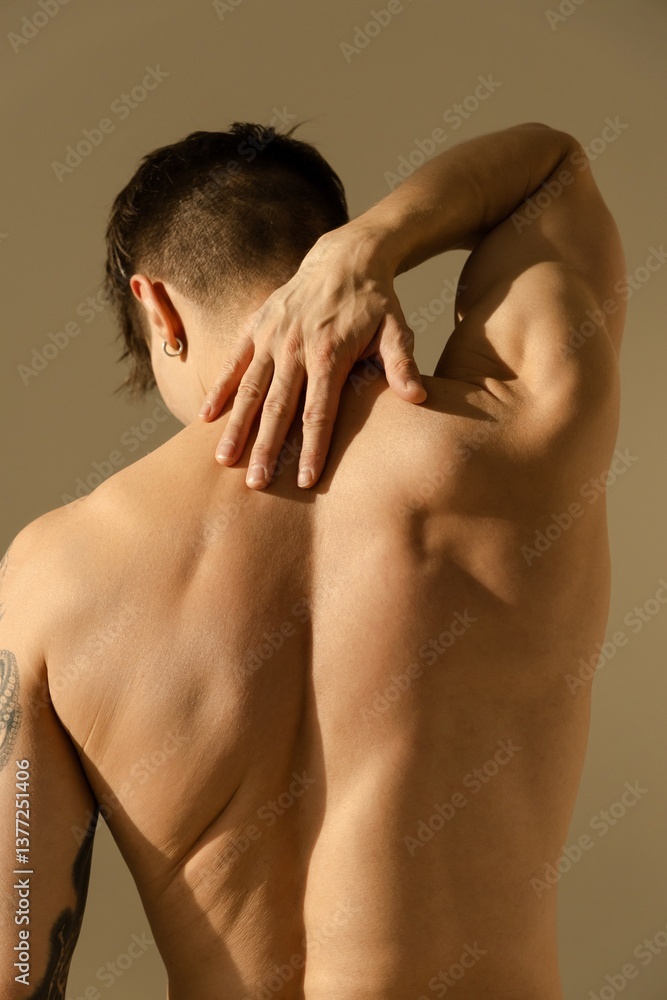 Man's back with natural lighting Man's back with natural lighting