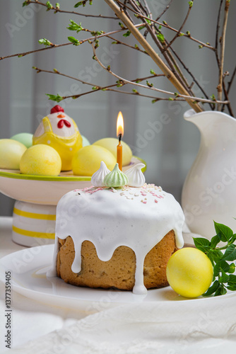 Easter. On the festive table there is Easter cake and painted eggs.