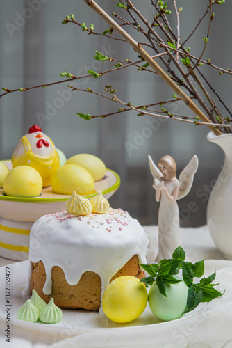 Easter. On the festive table there is Easter cake and painted eggs.