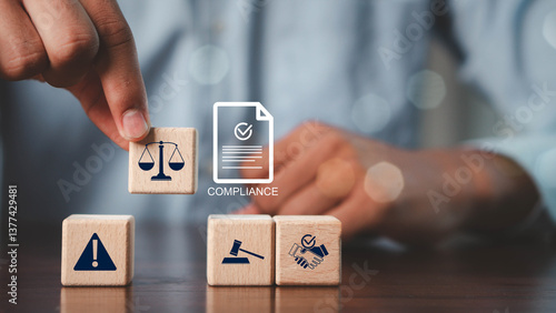 Compliance in business concept.Concept of compliance with icons on wooden cubes. Laws concept. Enforce laws, regulations and standards, comply with business policies.