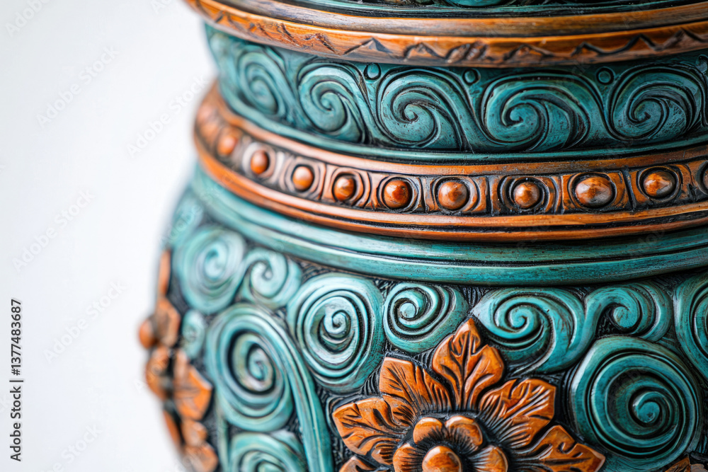 Close-up of a beautifully detailed ornamental vase featuring teal swirling patterns and orange flower accents, handcrafted and artistic. Close-up of a beautifully detailed ornamental vase featuring teal swirling patterns and orange flower accents, handcrafted and artistic.